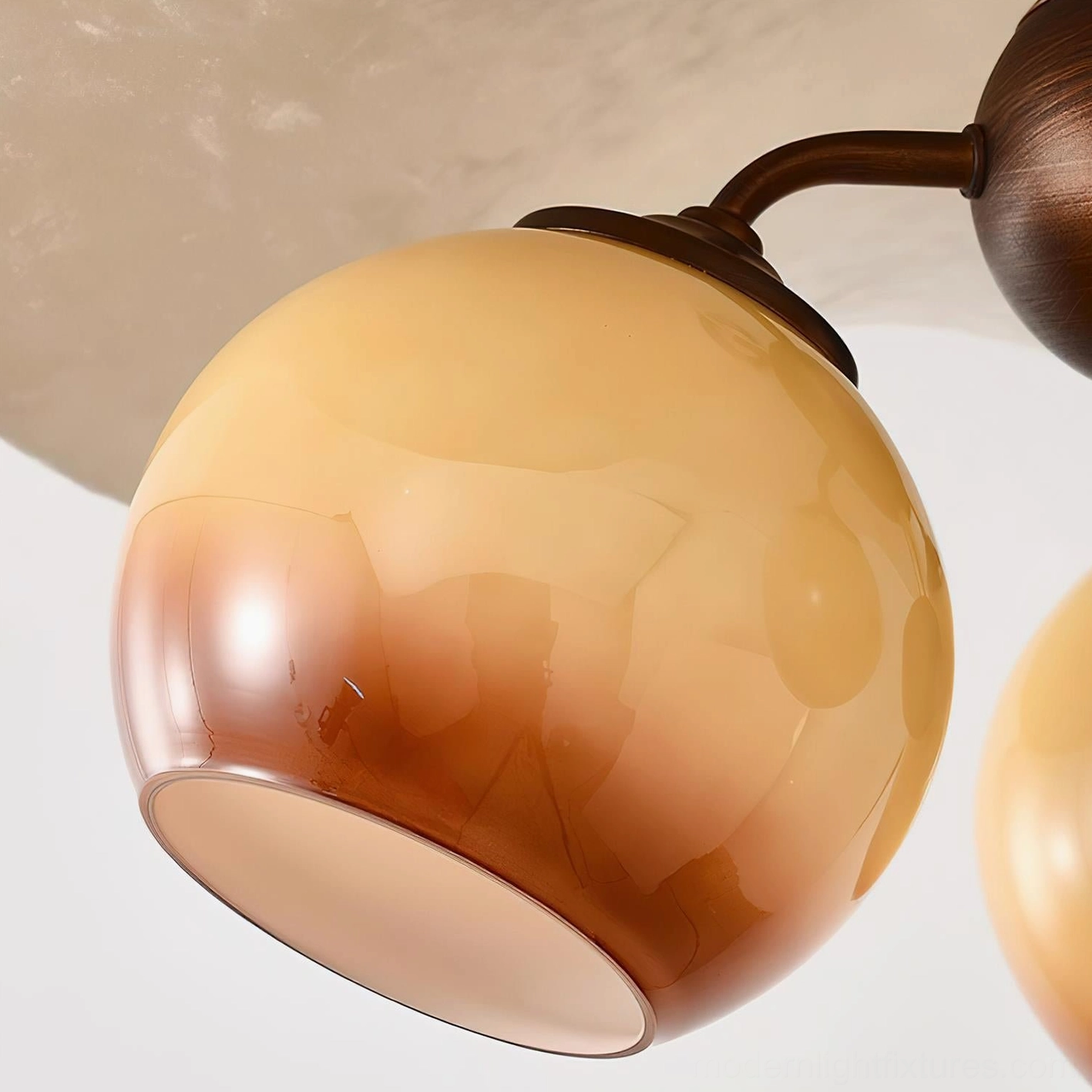 Talvera pendant light three glass spheres with warm-tone illumination and artistic fabric shade