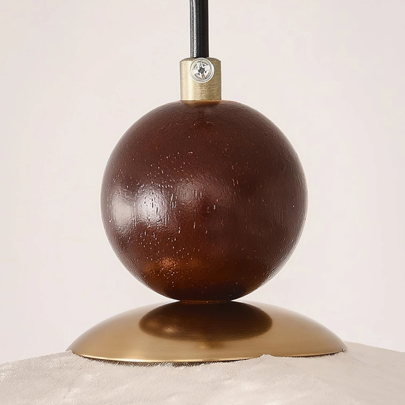 Talvera sculptural pendant light creating warm ambient glow in minimalist residential space