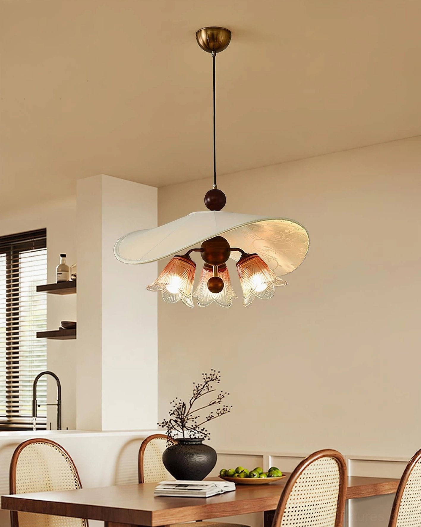 Multi-bulb pendant lamp Talvera with three glass spheres and metal fixtures in contemporary kitchen