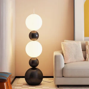 Tama LED floor lamp in beige living room with warm glowing white frosted globe shades and matte black base