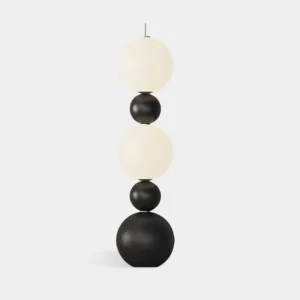 Tama modern stacked globe floor lamp with black and white spherical design on studio white background