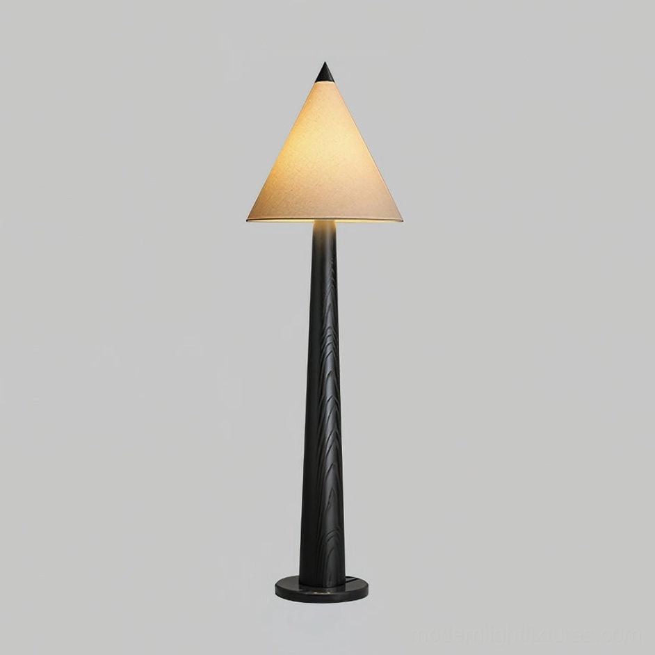 Taper Crest floor lamp with warm ambient lighting from linen cone shade and sculptural base