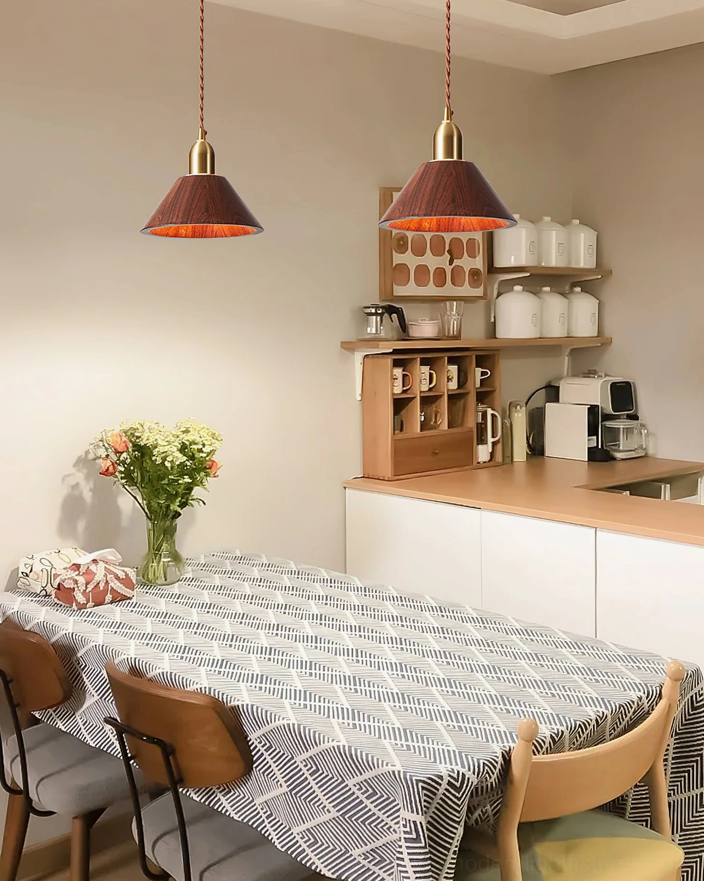 Tapered wood pendant light in Scandinavian dining room with warm ambient lighting