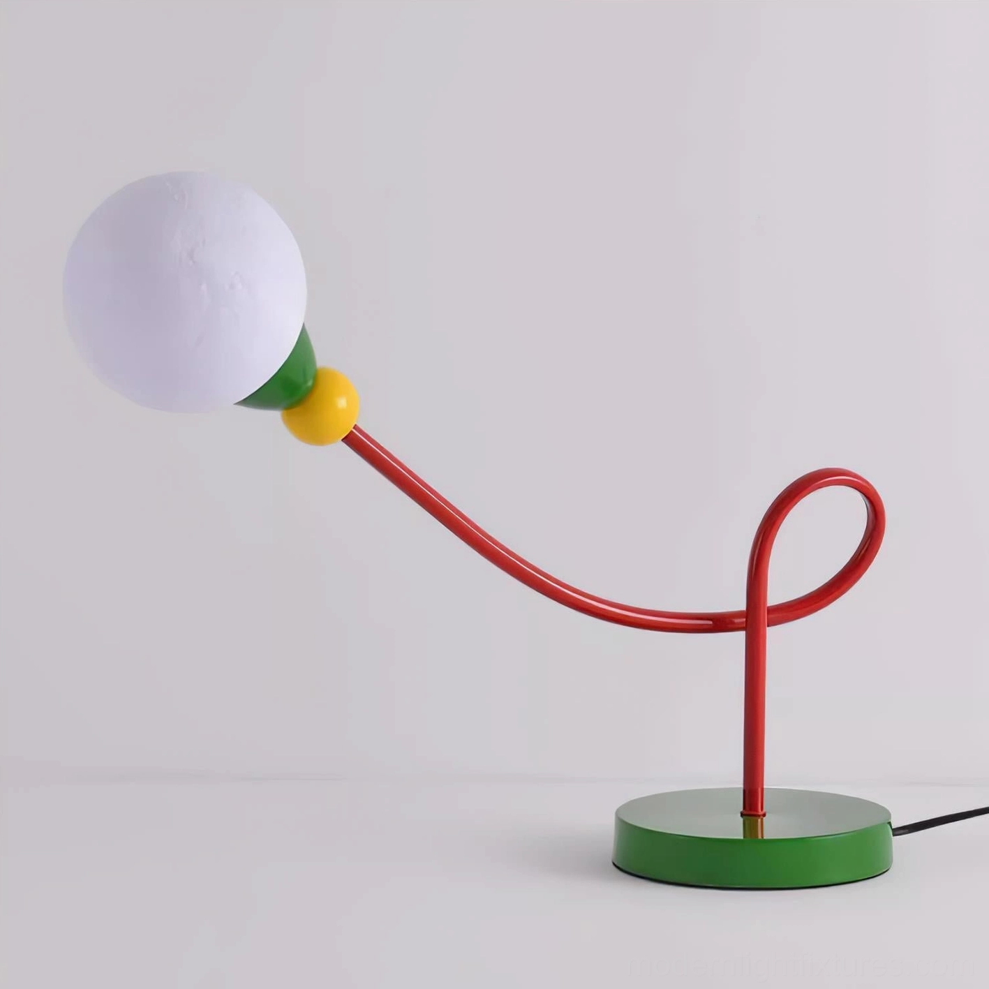 G9 table lamp in home office setup with open book and coffee cup for warm reading light