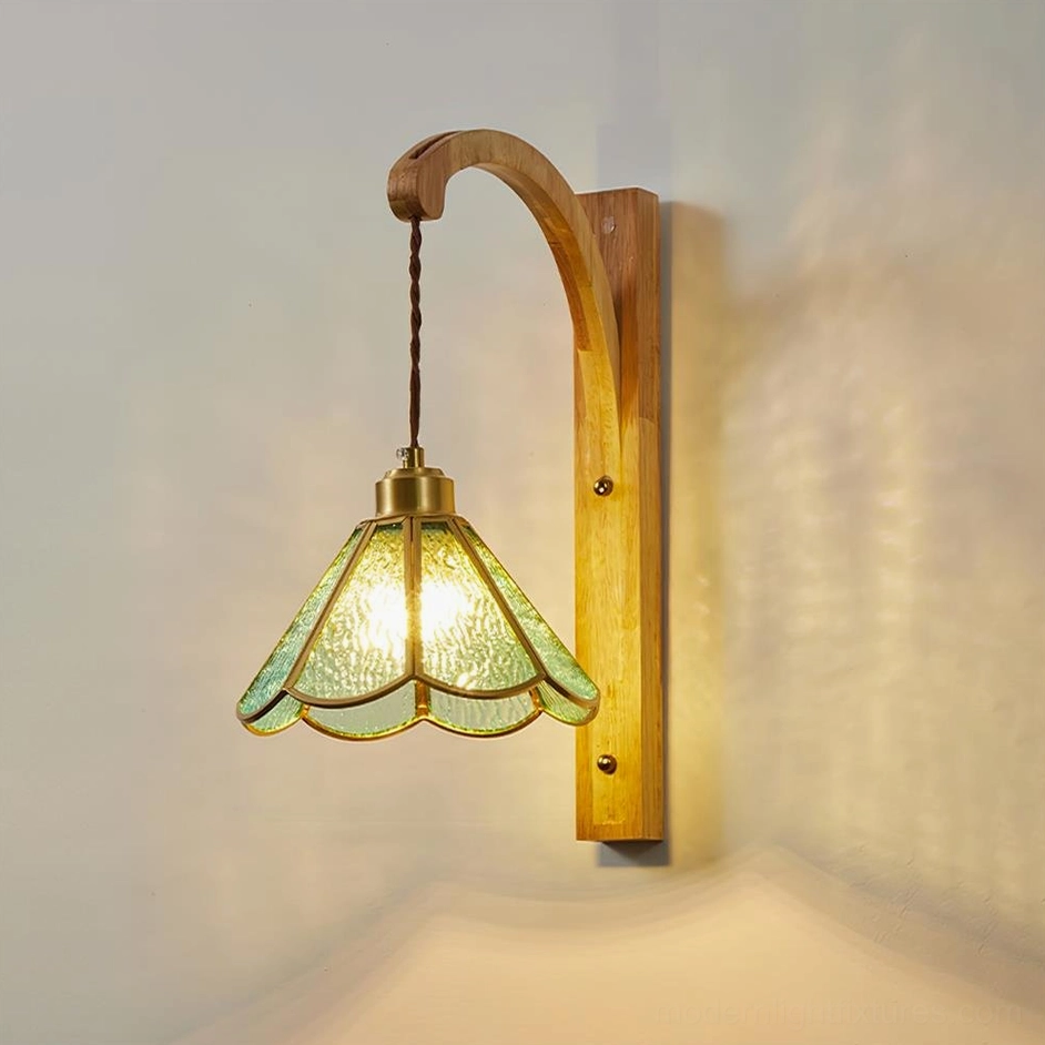 Tavelle amber petal wall sconce with walnut wood finish and blue glass detail view