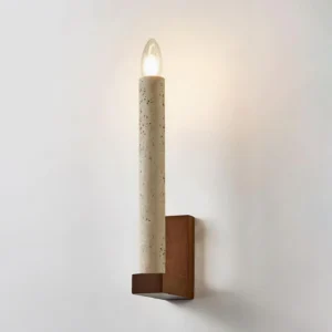 Tavero wall sconce three-quarter angle showing depth of wooden mount and textured travertine lamp body