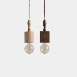 Tavik wooden pendant light set in cylinder and cube shapes with ash and walnut wood finishes, front studio view