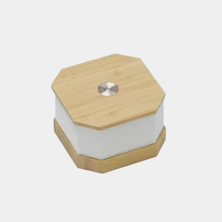 Tawa Fold accordion table lamp collapsed position three-quarter view with hexagonal bamboo base