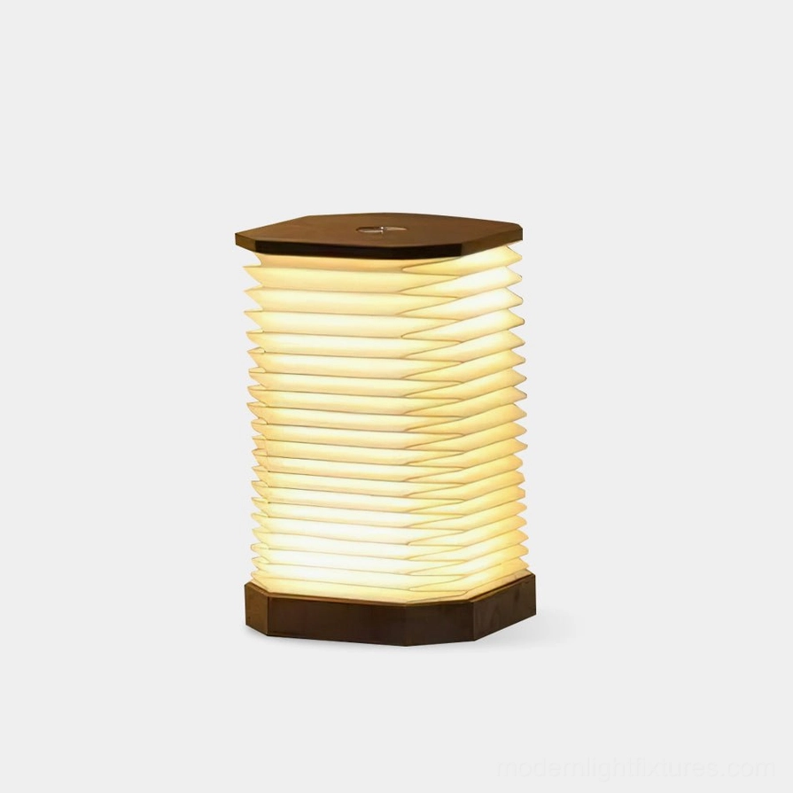 Tawa Fold accordion table lamp with hexagonal wooden base front view on white background