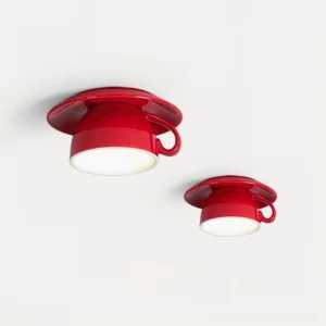 Two red ceramic teacup ceiling lamps side by side - showing cup handle details and saucer design
