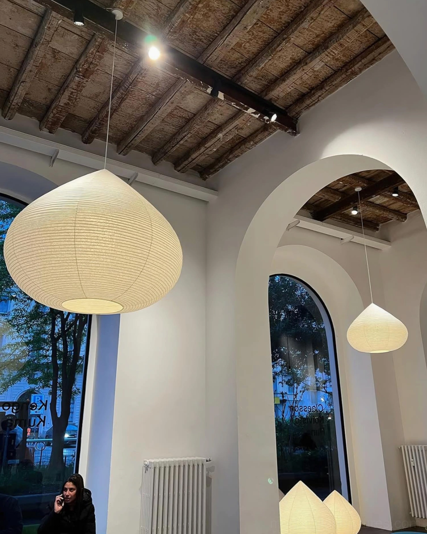 Sculptural teardrop washi paper pendant light in minimalist interior design setting