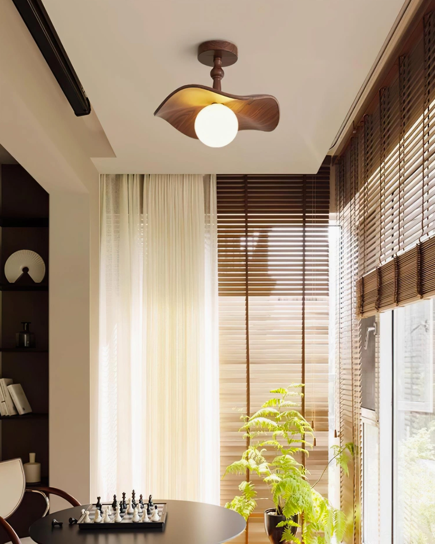 Teelin wavy ceiling light in game room dining space - semi-flush fixture with natural window light - walnut wood finish decor