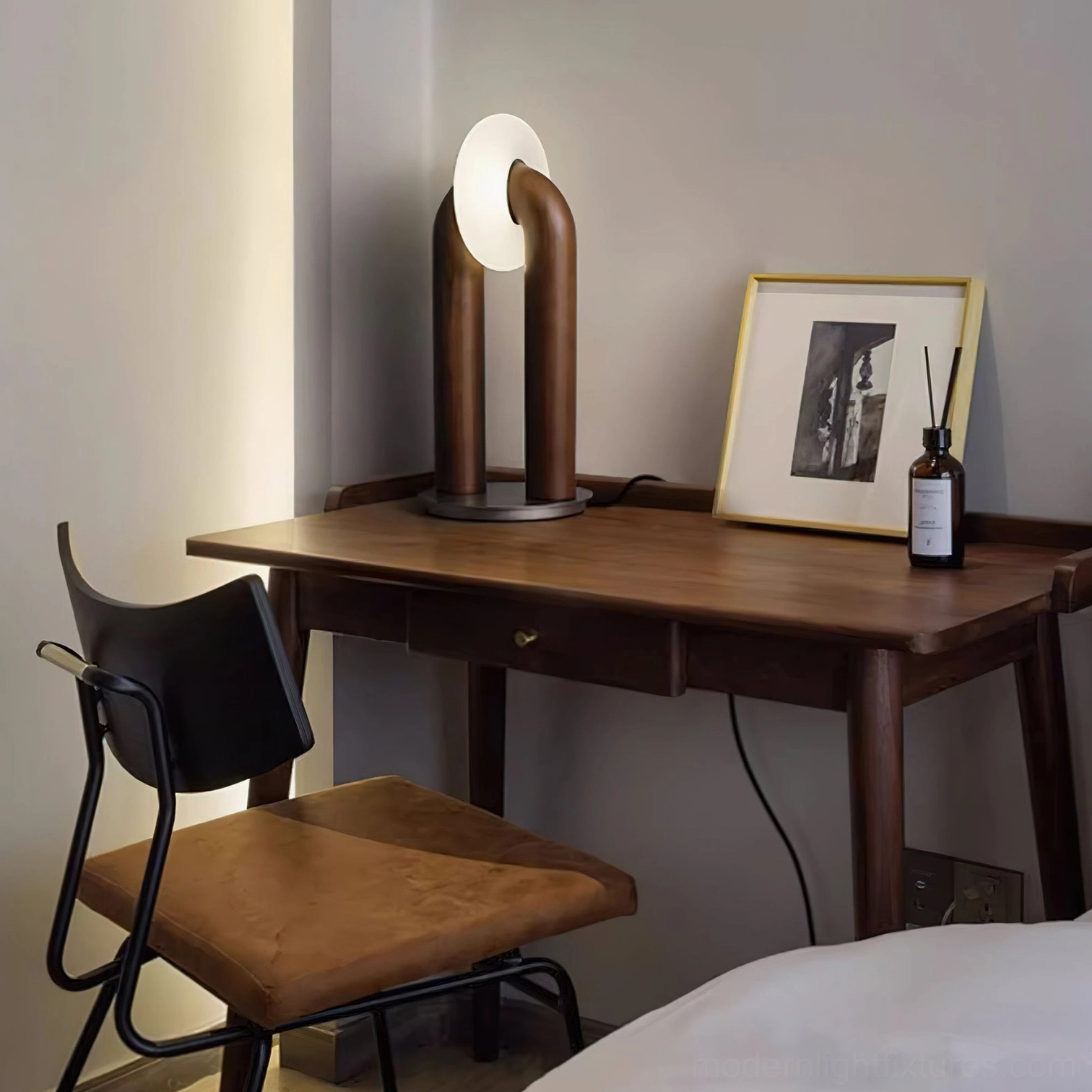 Teelo lamp with matte black stained ash finish in Scandinavian minimalist interior setting