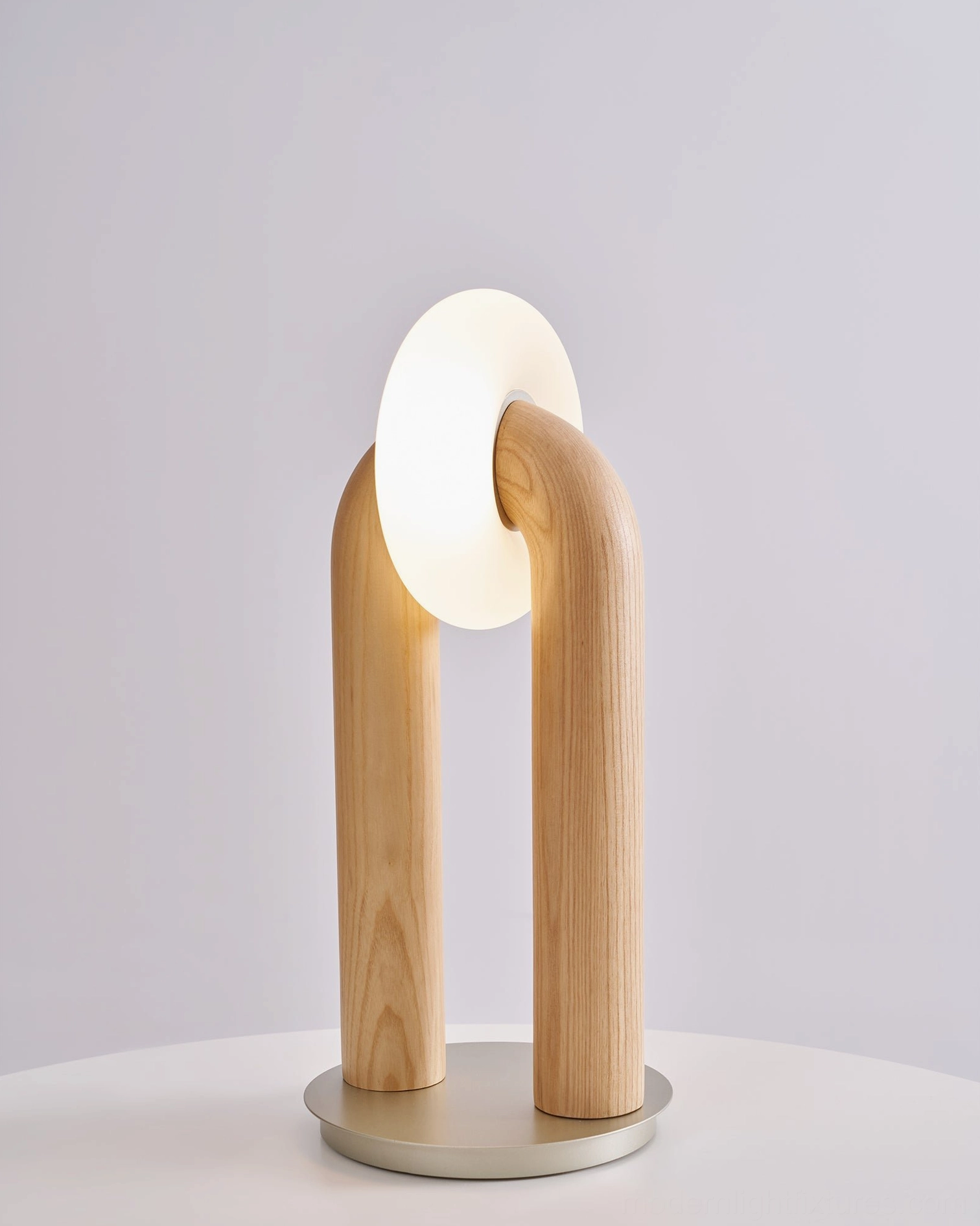 Teelo table lamp product shot showing frosted acrylic globe diffusion design and wood construction