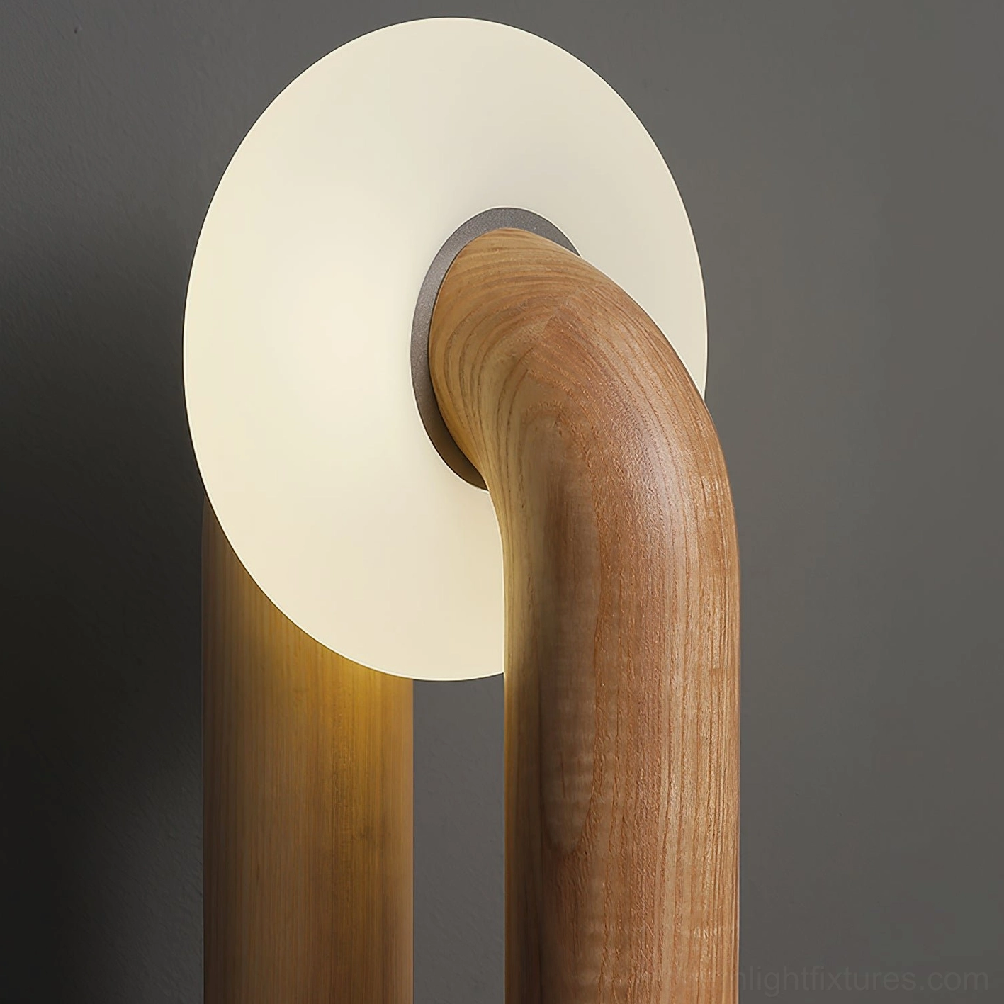 Close-up detail of Teelo lamp showing natural wood grain texture and glowing frosted glass shade