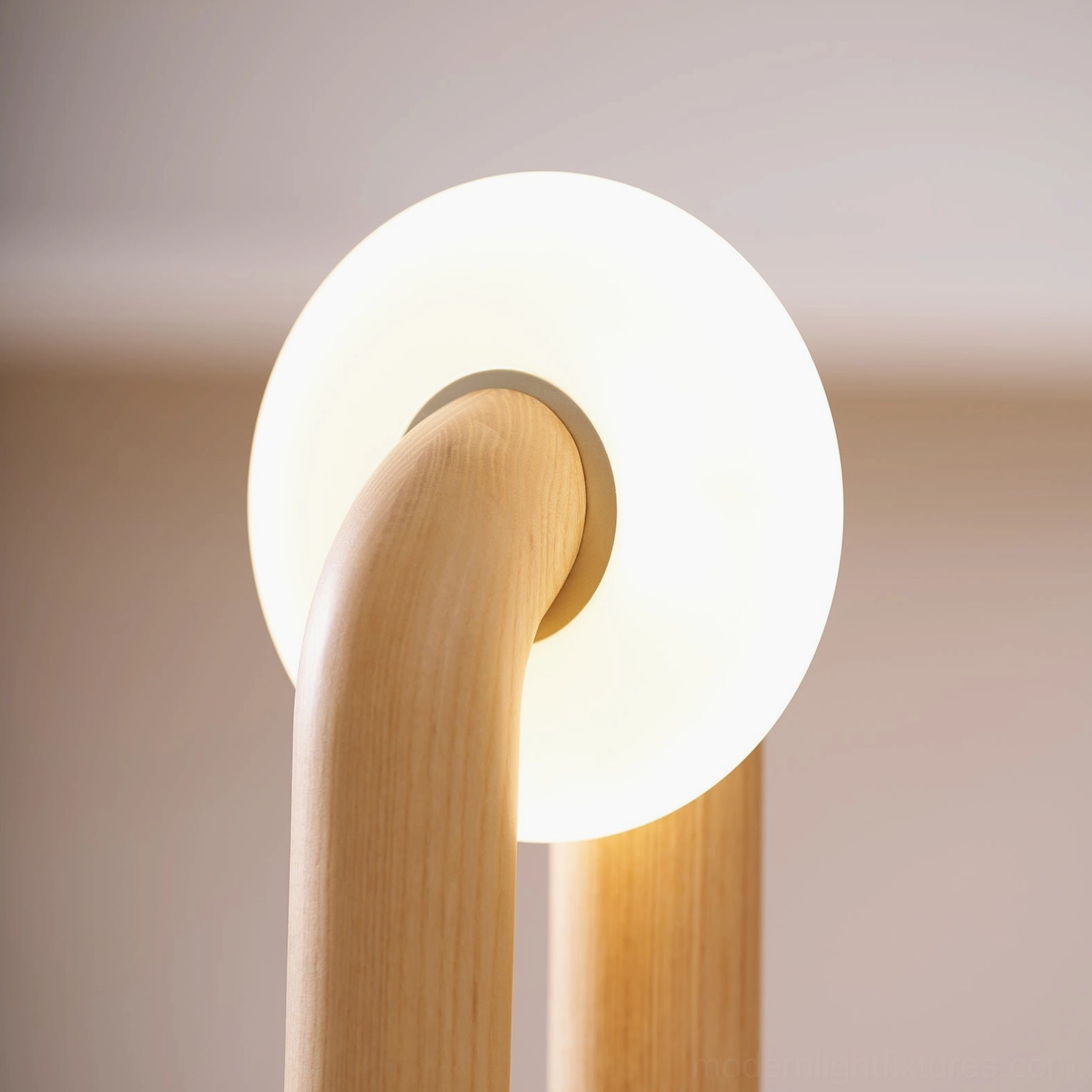 Teelo natural wood table lamp providing warm accent lighting in cozy home corner reading nook