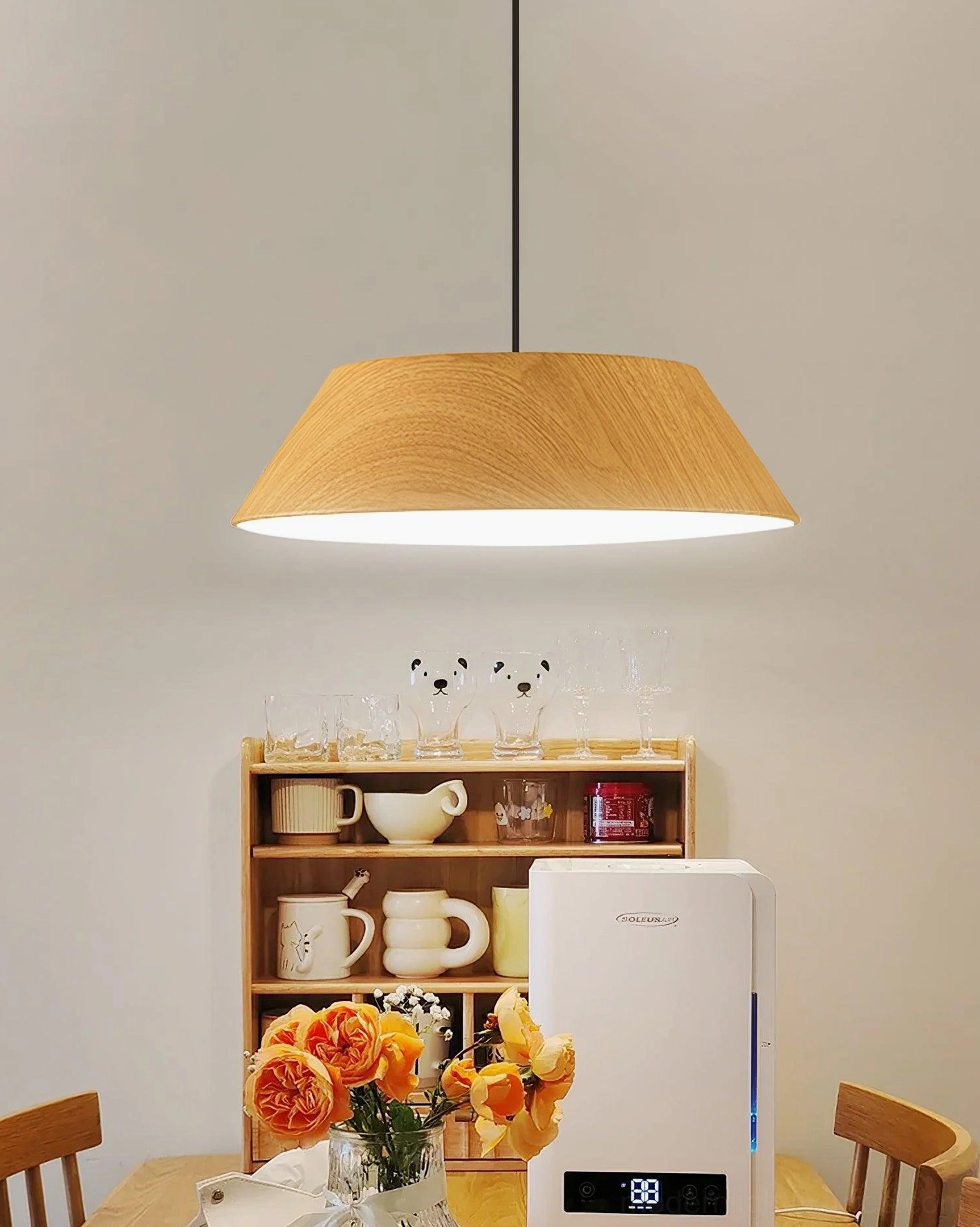 Light wood color Tekio pendant light in contemporary kitchen dining zone natural wood grain texture detail