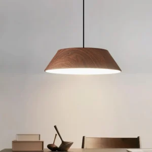Tekio pendant lamp with walnut wood finish installed in modern dining room overhead view warm ambient lighting