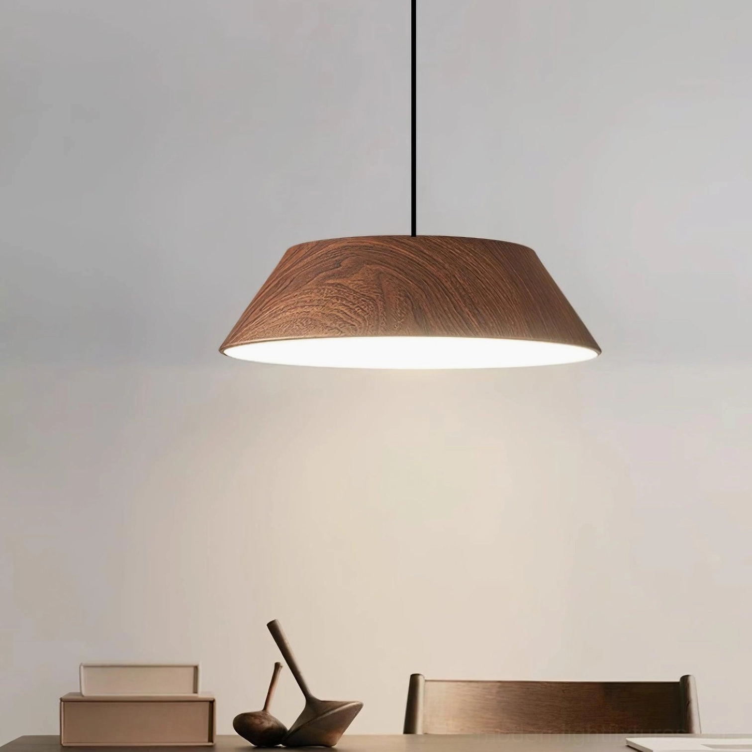 Tekio pendant lamp with walnut wood finish installed in modern dining room overhead view warm ambient lighting