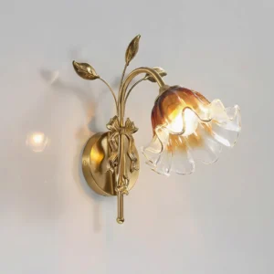 Tender Glimmer botanical wall lamp with gradient amber glass and gold brass leaf details, side profile
