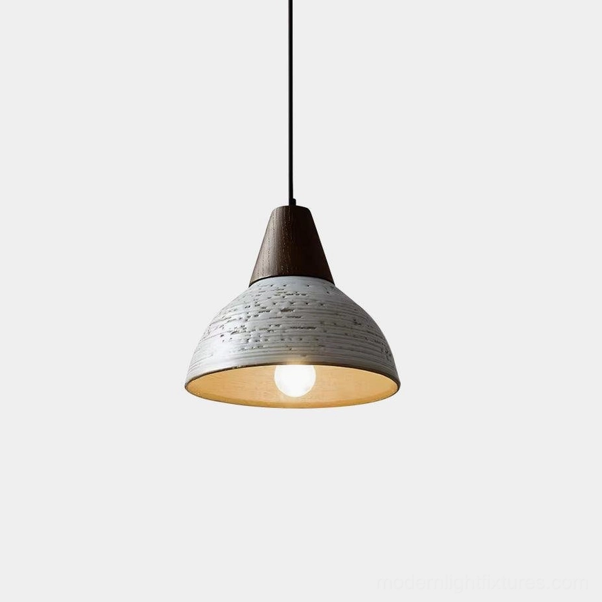 Tera ceramic pendant light with textured off-white shade and walnut wood fixture, frontal close-up view showing artisan craftsmanship and wabi-sabi design