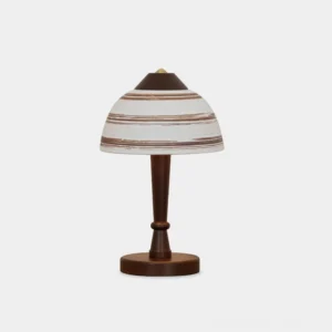 Tera ceramic wood table lamp frontal view with striped fabric shade and walnut wooden stem on white background