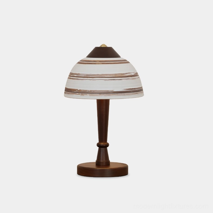Tera ceramic wood table lamp frontal view with striped fabric shade and walnut wooden stem on white background