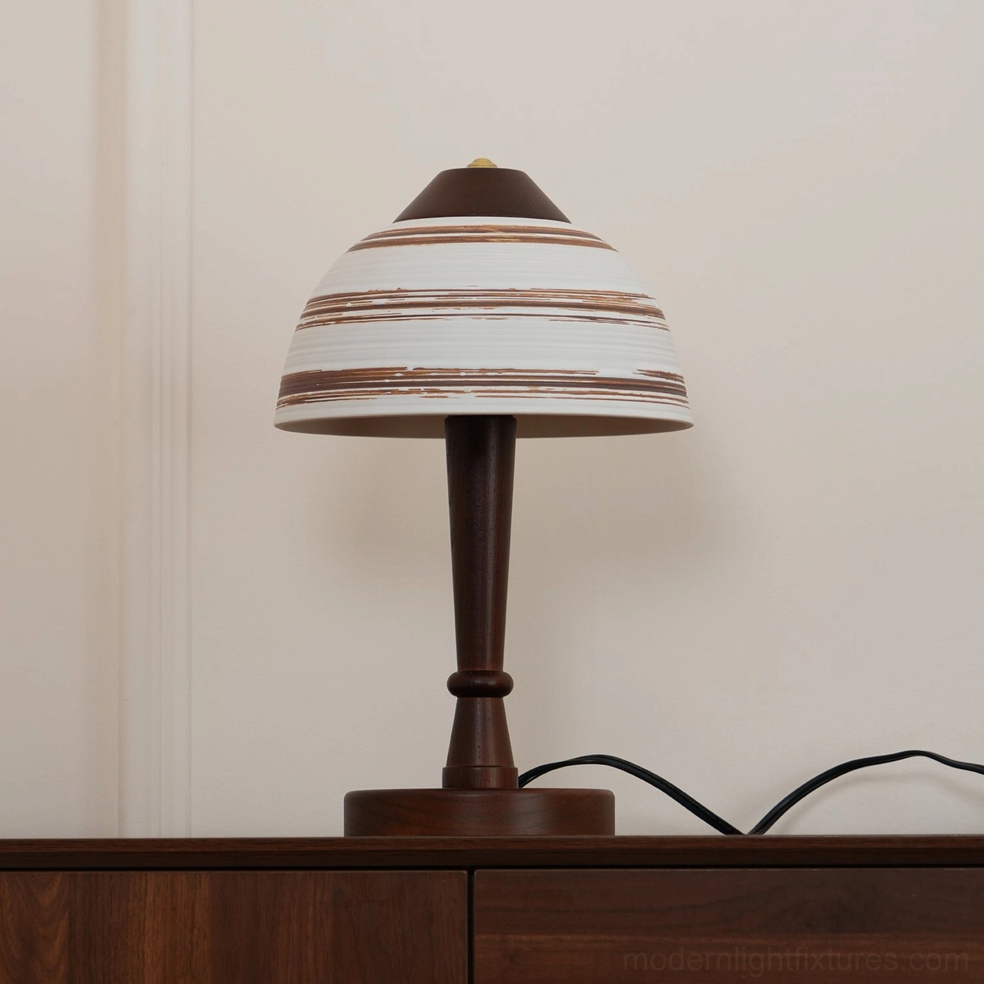 Tera modern table lamp with ceramic details positioned on side table in contemporary interior