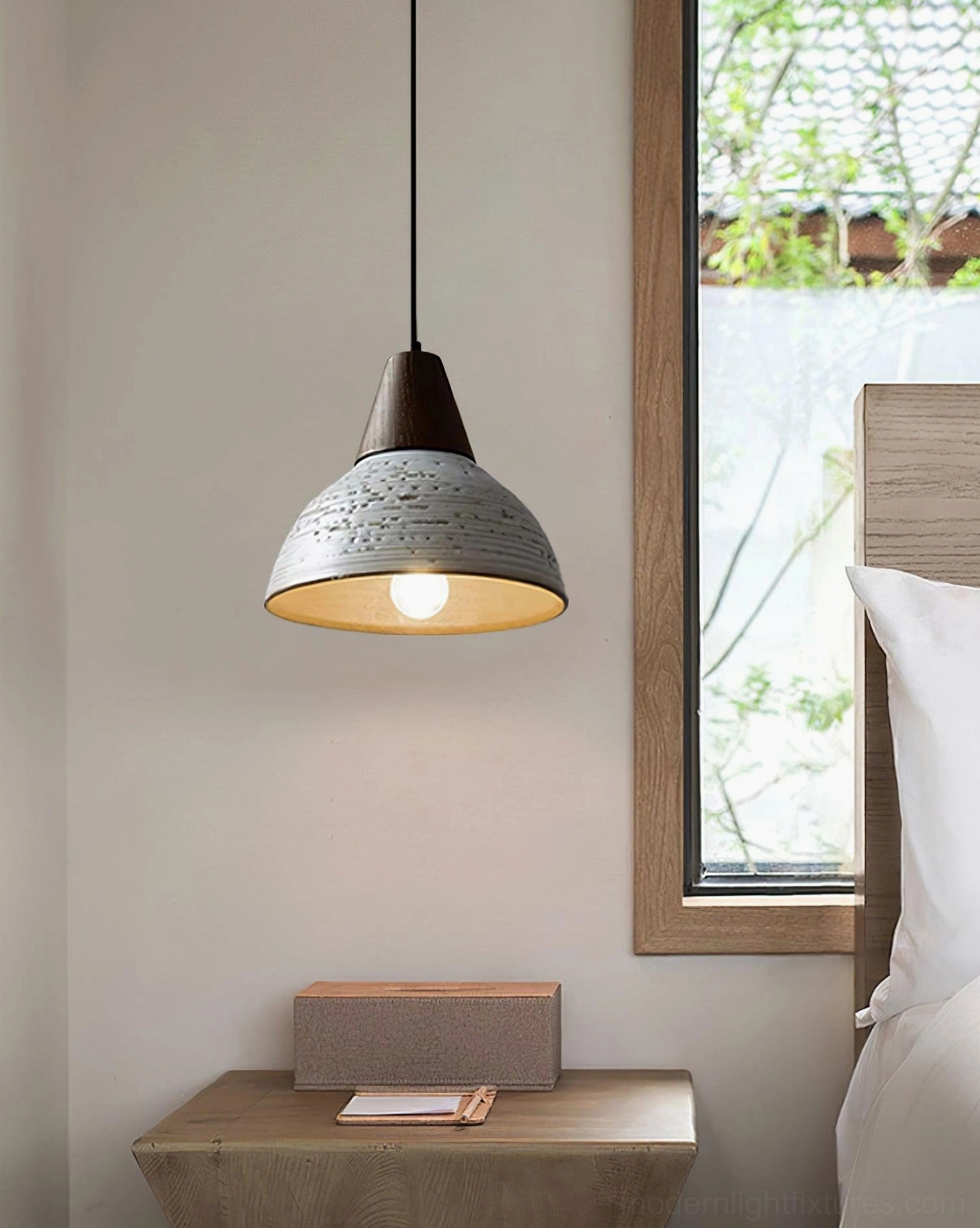 Tera ceramic pendant light positioned near bedroom window with wooden bedside table, minimalist warm bedroom ambiance and lighting