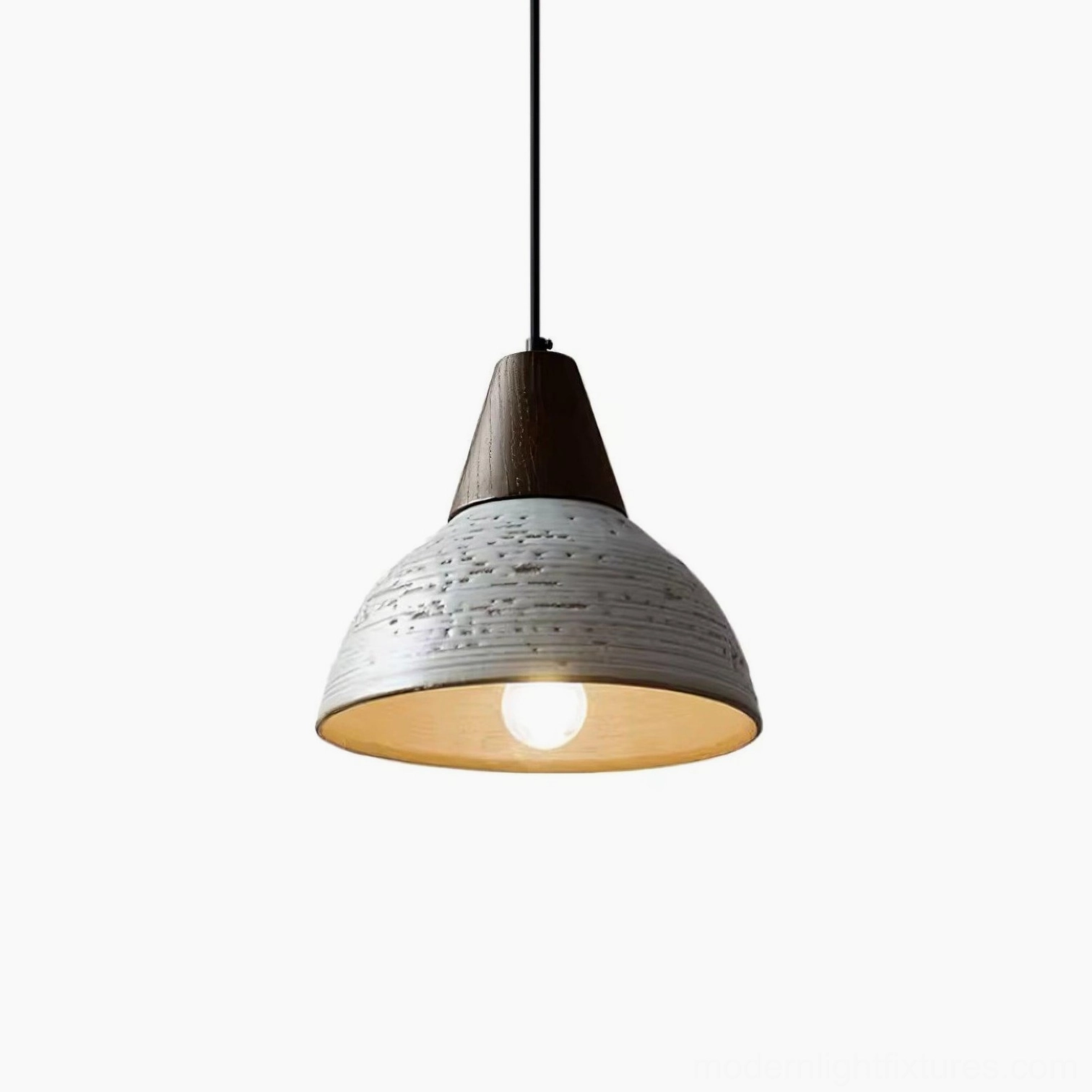 Tera ceramic pendant lamp demonstrating how textured shade creates soft diffused light perfect for dining and gathering spaces