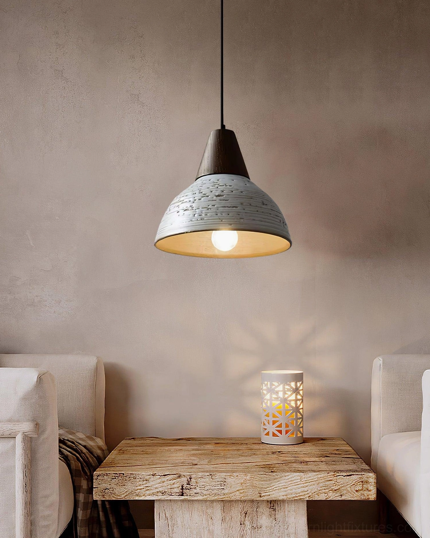 Single Tera pendant light in cozy living room with rustic neutral styling, wooden coffee table and minimalist home décor