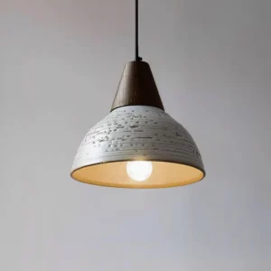 Tera pendant lamp in Walnut and White finish, three-quarter angle displaying warm inner glow and distressed ceramic exterior texture