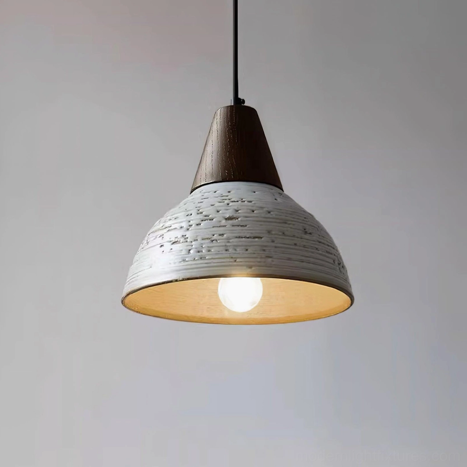Tera pendant lamp in Walnut and White finish, three-quarter angle displaying warm inner glow and distressed ceramic exterior texture