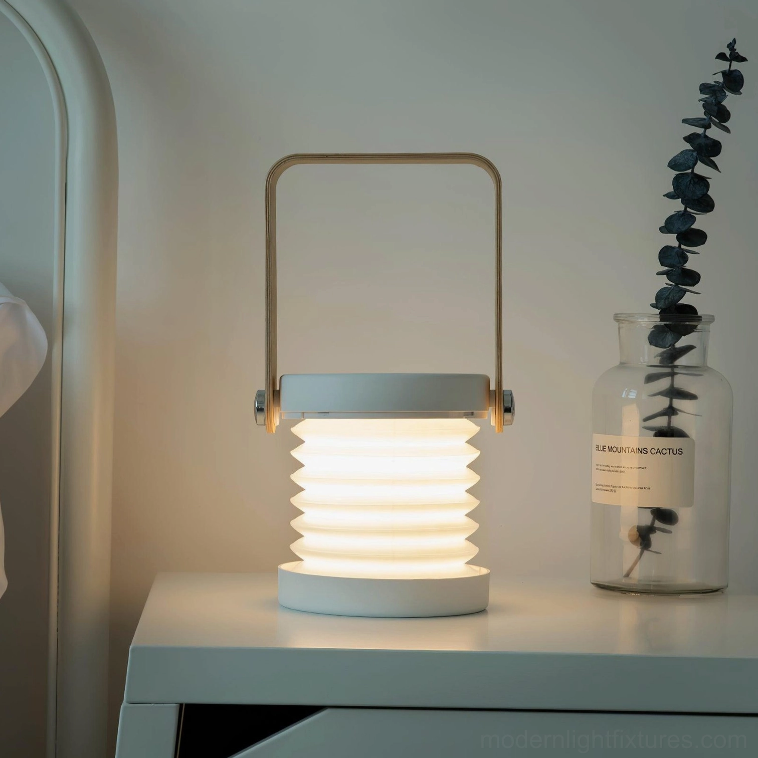 Terna Portable Table Lamp - Scandinavian minimalist design aesthetic with natural wood and metal accents in home office setting