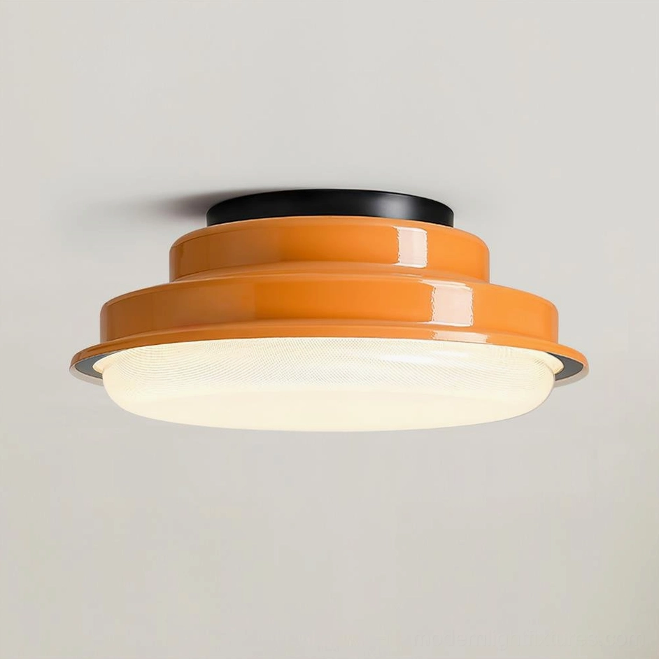 Orange finish terraced stack geometric ceiling light fixture in mid-century modern interior setting
