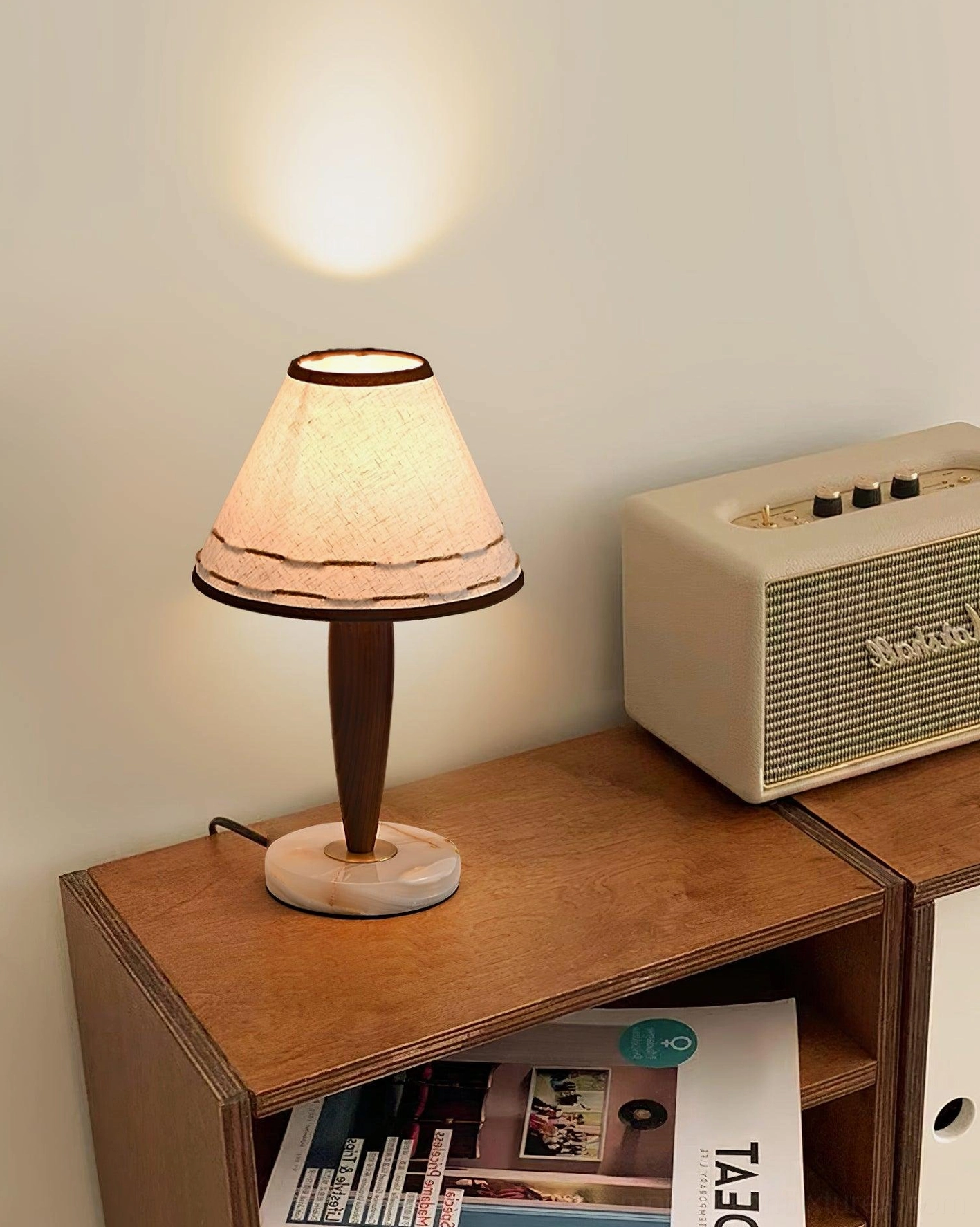 Terracotta and ash wood table lamp on wooden side cabinet with vintage radio - layered room lighting