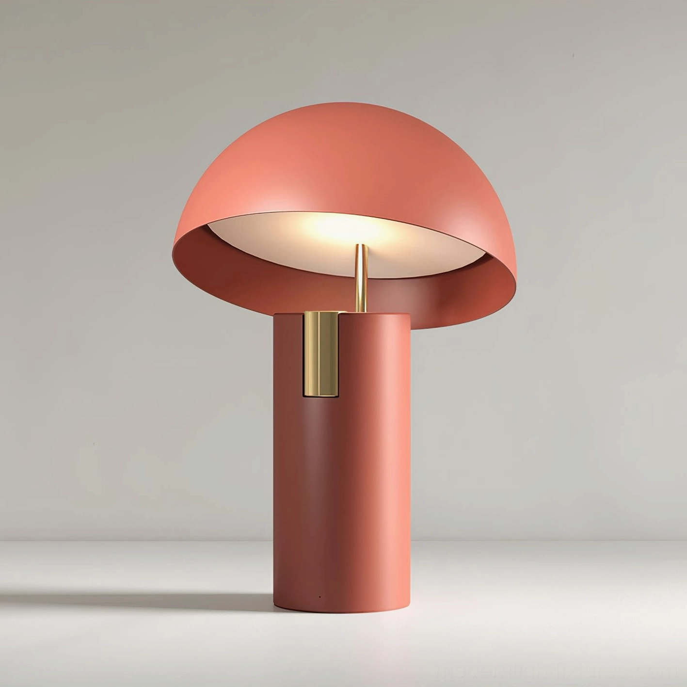 Illuminated terracotta Avo table lamp with matte finish and brass trim, warm glow ambiance lighting
