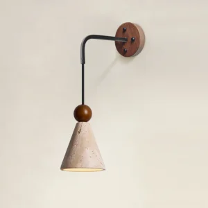 Terrano wall sconce angled view showing black metal arm, wooden sphere detail, and beige travertine shade installation