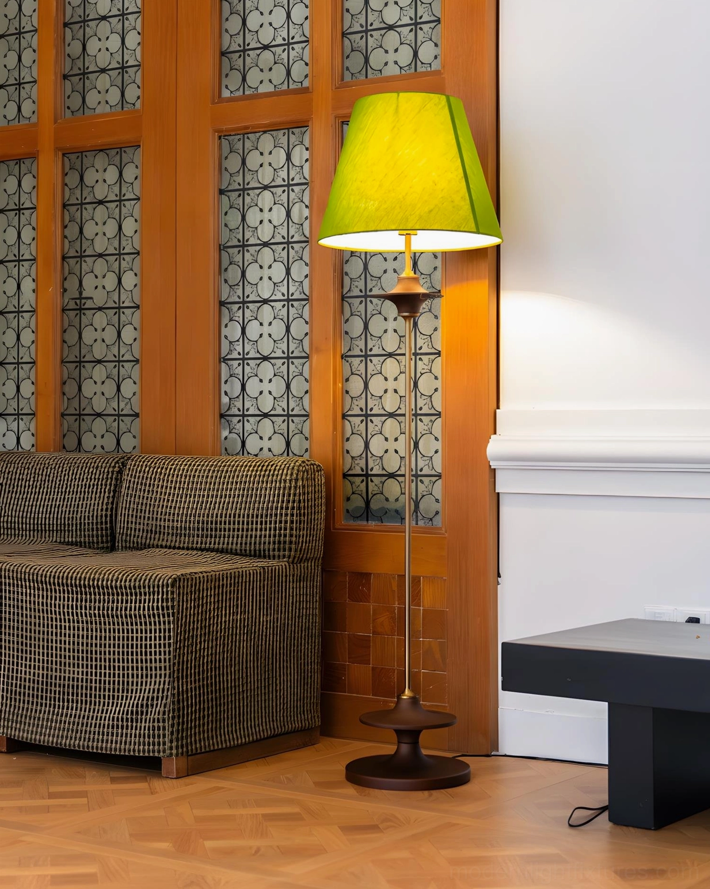 Terrava mid-century floor lamp with yellow-green shade displayed in retro living room with checkered sofa
