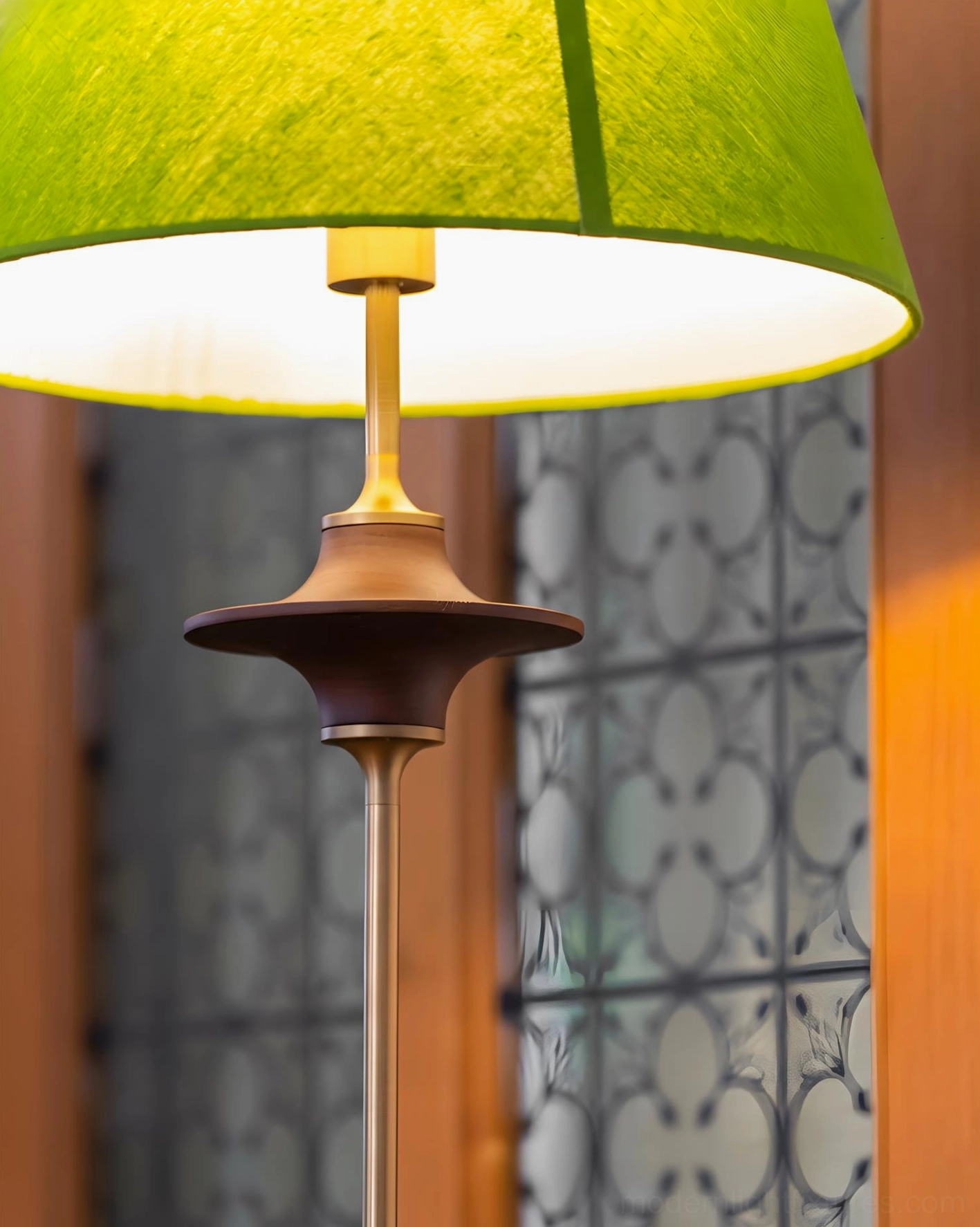 Terrava floor lamp with walnut wood base and olive green shade positioned in modern living space