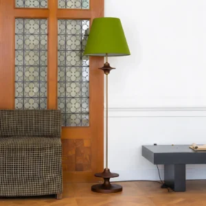 Terrava modern floor lamp with walnut wood accents and green fabric shade in vintage entryway with stained glass door