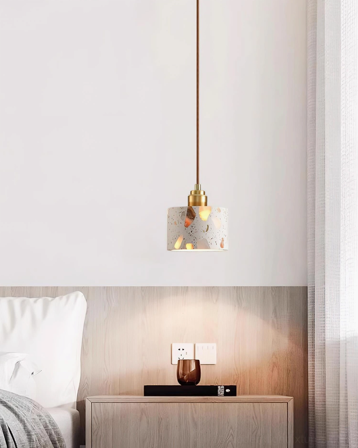 Contemporary terrazzo pendant lamp installation in Scandinavian minimalist interior