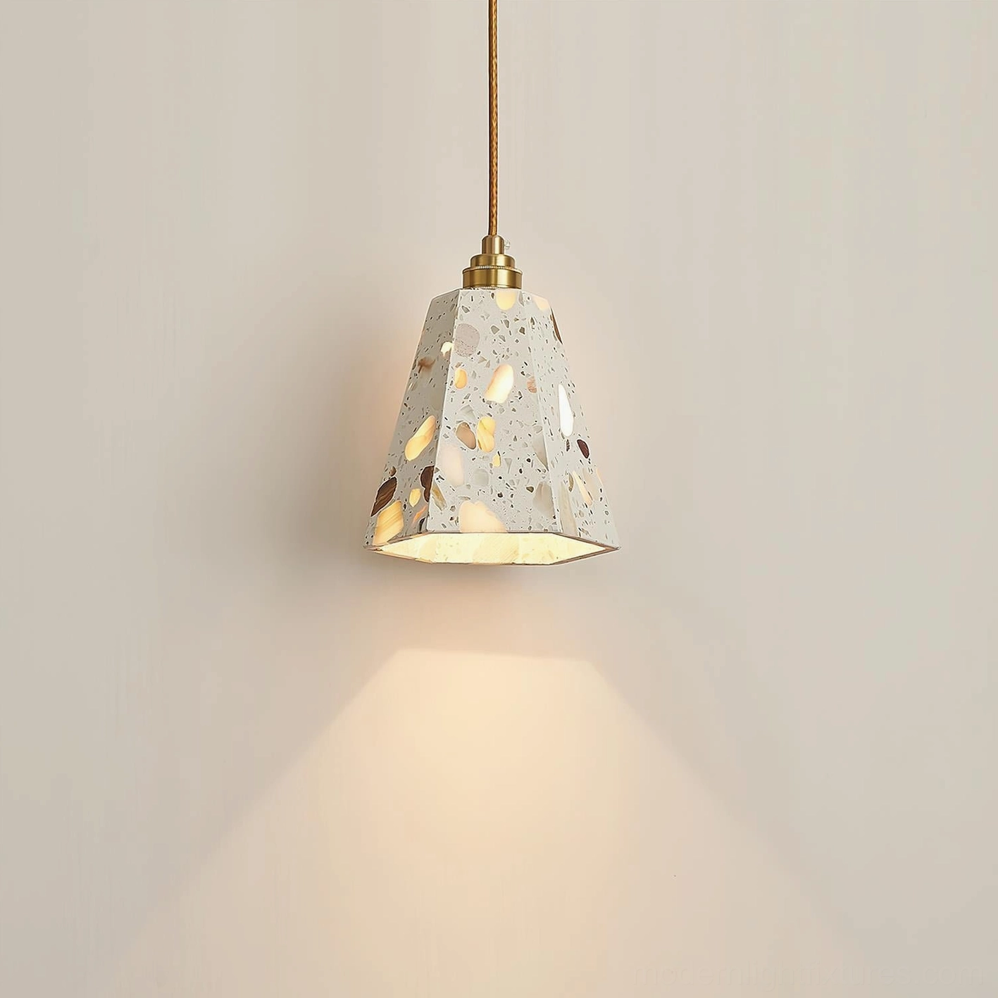 Cluster installation of terrazzo pendant lights creating layered ambient lighting design