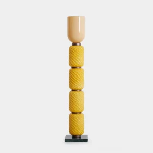 Tessara geometric floor lamp with honey-toned stacked diamond-patterned glass column and cylindrical shade on marble base, frontal studio view
