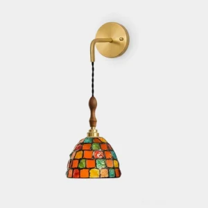 Tessaro artisan mosaic wall sconce with hand-set stained glass shade and brass arm, front studio view