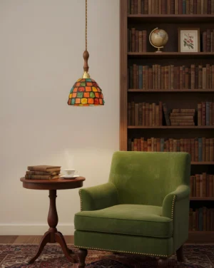Tessaro glass pendant light in vintage study room casting warm layered glow through mosaic shade
