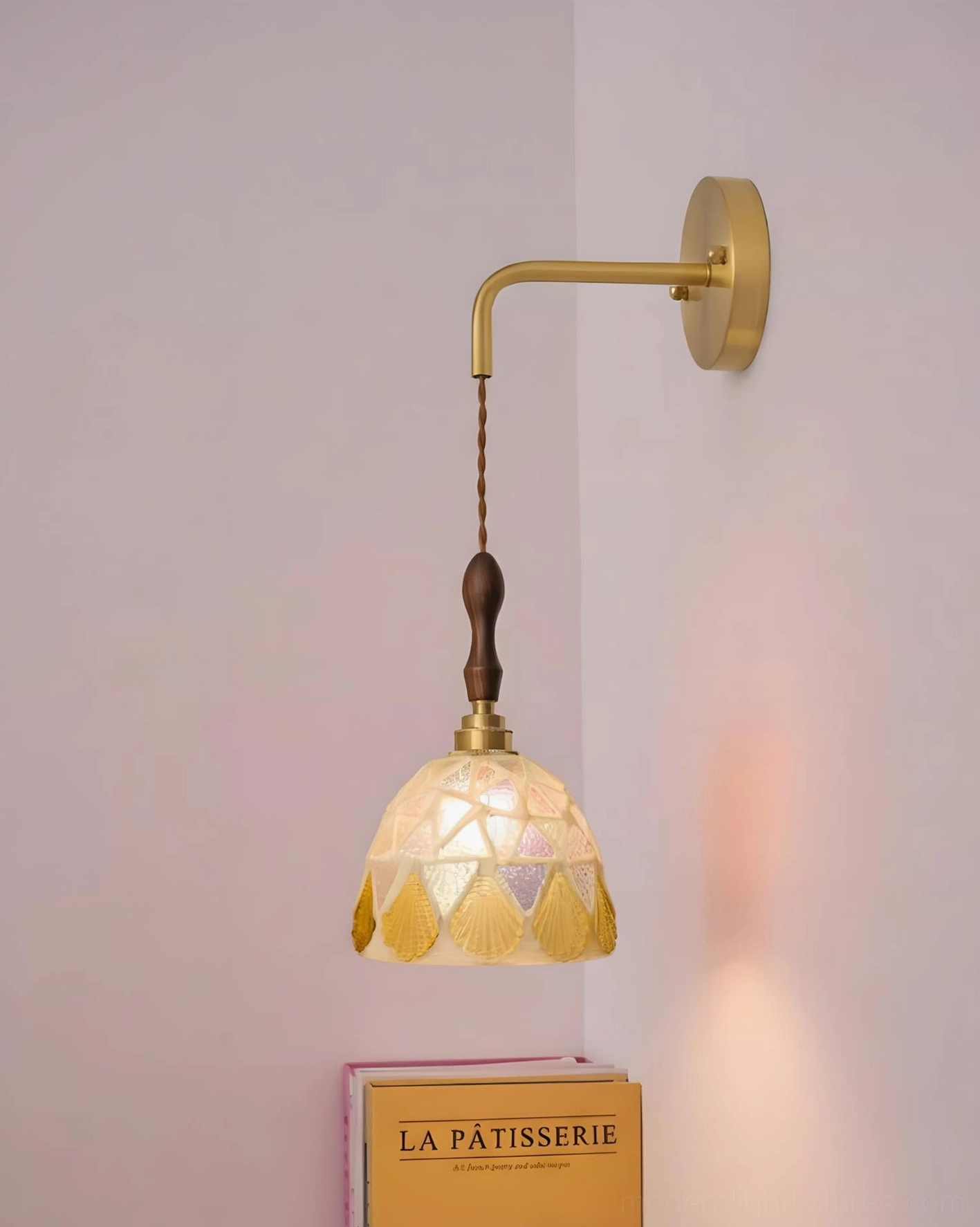 Tessaro wall sconce showing brass curved arm and wood accent detail, side profile perspective