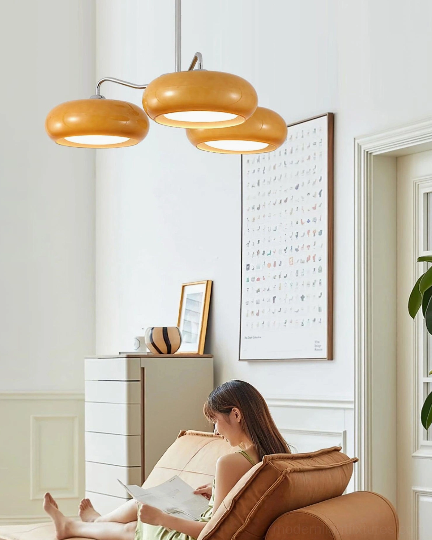 Tetra mid-century 3-light chandelier with amber glass in home reading nook - cozy task and mood lighting