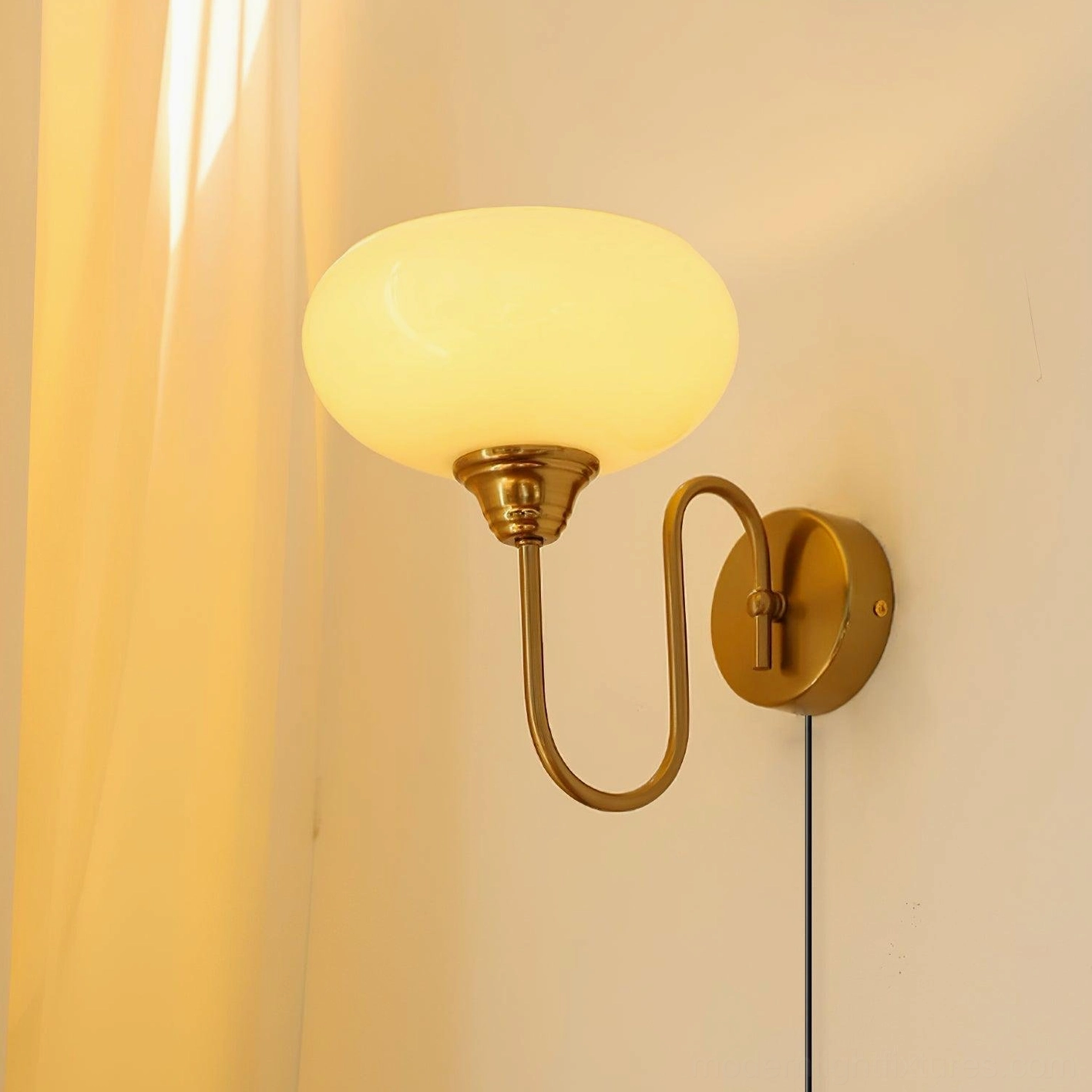Textured glass plug-in sconce in beige finish, mounted above console table in living room with modern décor and artwork