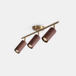 Thio 3-head wooden track ceiling light with brass arms and walnut rail, front studio product view